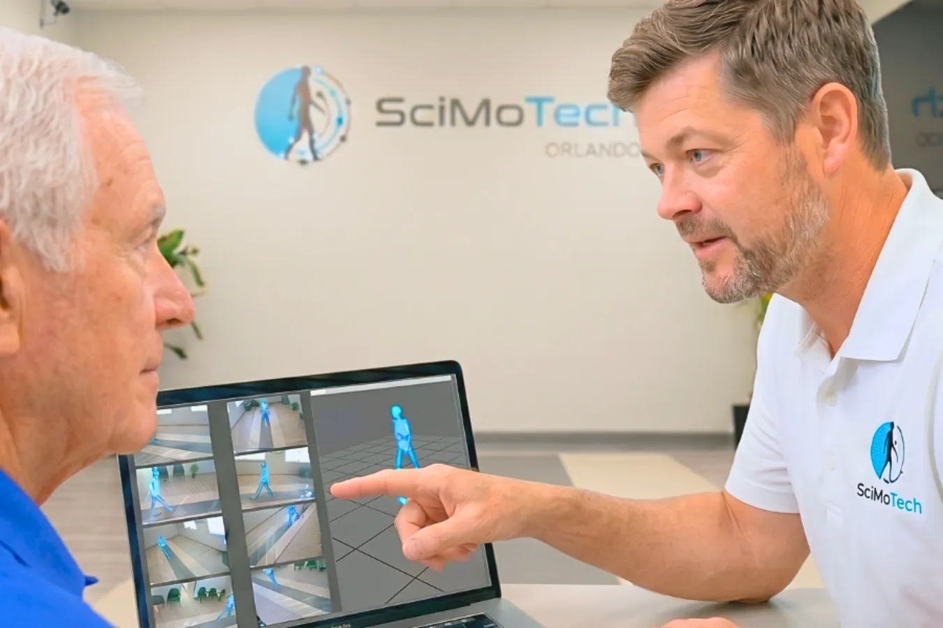 Clinician reviewing gait analysis results with a patient at SciMoTech